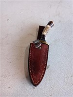 Damascus knife with stag handle and leather seath