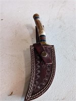 Damascus knife with stag handle and leather