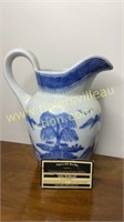Asian motif blue and white pitcher