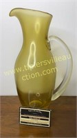 Amber art glass pitcher with applied handle