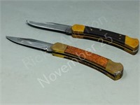 2- folding knives,  1 Buck 110,