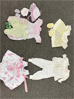 Lot of doll clothes with shoes and hat