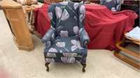 Floral print arm chair. Measures 26x27x41 inches