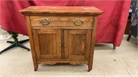 Antique wooden cabinet on wheels. Measures