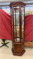 Lighted wooden mirrored display stand. Comes with