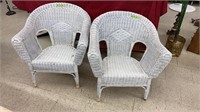 Two white wicker-style chairs. Each measures