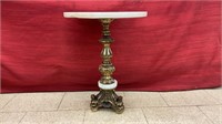 Brass plant stand with marble top. Measures 15