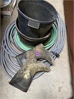 rubber boots/ two hoses and water trough