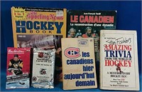 Four hockey books and two unopened hockey cards