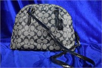 Double zippered handbag