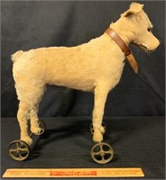 DESIRABLE STEIFF MOHAIR DOG ON CAST IRON WHEELS