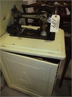 Singer sewing machine w/ cabinet