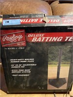 Two boxes batting tee, one complete one incomplete