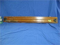 Fly fishing rod displayed on a board  40x 5"