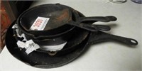 (5) cast iron skillets in graduated sizes
