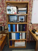Book shelf full of office supplies