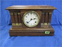 Antique mantle clock with pendulem and key
