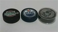 Three Hockey Pucks Incl. Toronto Maple Leafs