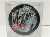 Signed #34 Manny Legace 2002 Red Wings Puck