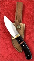 Fixed bladed knife with brass guard, horn scales,