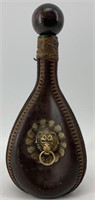 Beautiful glass wine bottle, hand wrapped in leath
