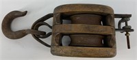 Vintage wood and steel block and tackle pulley in