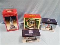 Lot of 4 collectable Christmas Village figurines i
