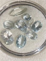 Clear and light blue faceted stones