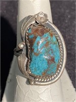 Natural turquoise stone mounted in ornate