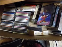 box of vhs cds and dvd
