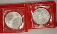 Two Singapore $10 silver coins