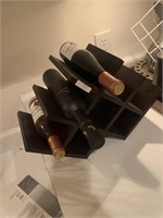 Wine rack and 3 bottles