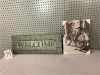 Bike canvas (new), welcome sign (cracked)