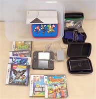 NINTENTO DS HAND HELD CONSOLE AND GAMES IN TOTE