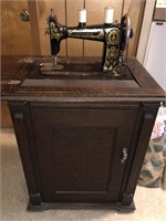 Damascus grand sewing machine and sewing cabinet