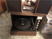 Vintage solid state record player with speakers