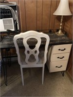 Desk with white chair and table lamp