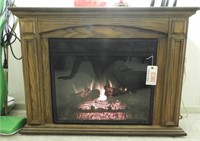 Oak trimmed electric home heater fireplace