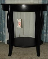 Black oval font open face lamp table