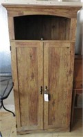 Pine two door armoire style storage cabinet