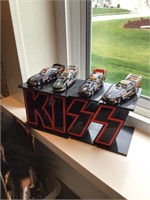 Kiss dragsters on stand