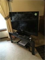 39" flat screen tv, w/ black/glass stand 42x16x19,