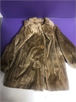 Light tan fur coat with beige lining