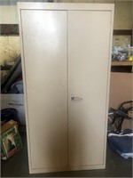 Large beige metal storage locker w/contents