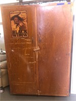 Huge wooden storage cabinet with signed poster
