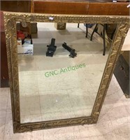 Antique fancy gold framed wall mirror, dated