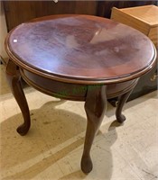 Small round side table, with a fake drawer in the