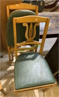 Two vintage folding chairs with a green padded