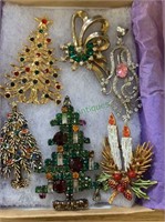 Six vintage holiday brooches, most set with