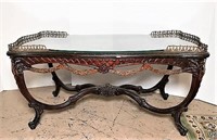 Ornate Carved Coffee Table with Inlaid Wood,